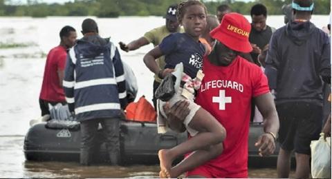 People cling to treetops as 'worst floods in a generation' sweep Mozambique